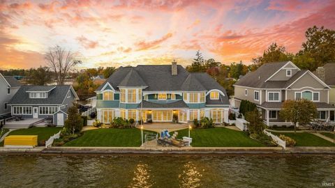 Welcome to this luxury residence set on Kale Island, nestled amidst the shimmering waters of Lake Wawasee, Syracuse, IN. Offering an impressive six Bedrooms, all with views of the water including Two Master Bedrooms with incredible Ensuite Bathrooms....