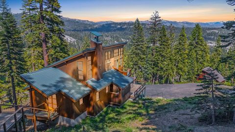 Distant ridge-top views are showcased from every room of this stunning architectural gem nestled in the charming ski village of Bear Valley, California. Perched on a rugged ridge, the home offers breathtaking vistas of the Dardanelle mountain range a...