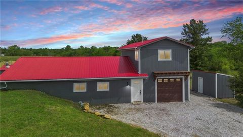 Welcome to your ideal home in Holden, MO! This newly completed gem sits on nearly 9 acres of scenic beauty, revealing a perfect balance of modern comfort and rustic charm. Step inside to discover an impeccably designed interior featuring hand-burnt p...