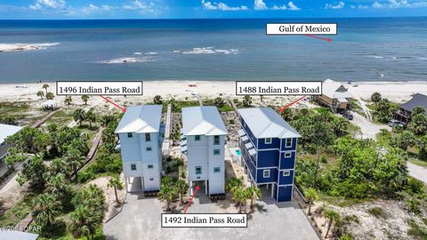 PREMIER LUXURY GULF FRONT 6BD/6.5BA BEACH HOUSE on Indian Pass with PRIVATE POOL. Fully furnished & rental ready, this coastal oasis offers a tremendous income-stream. An open concept kitchen, dining & living space features polished high-end finishes...