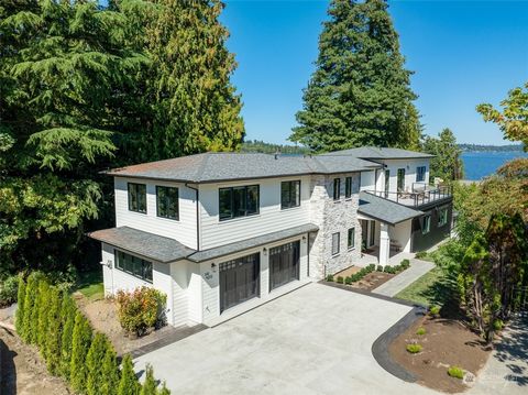 Step into this charming French country style manor tucked away in Mercer Island's sought after North end. This custom built residence showcases exquisite craftsmanship and tasteful luxury, boasting high end design finishes throughout. Relax in the el...