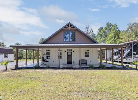 *Home has an assumable VA loan.This charmer is going to knock you right off your feet! It is the epitome of southern charm and modern elegance. Step into a world of comfort and luxury as you explore the meticulously designed interior. The open-concep...