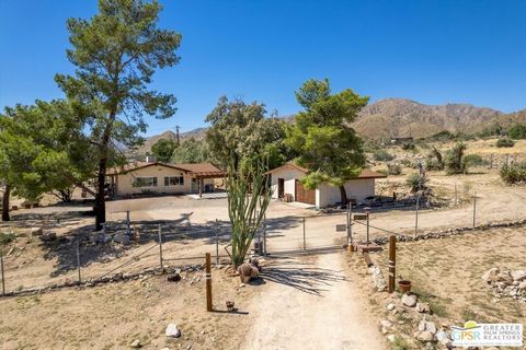 If you've been looking for acreage that's completely fenced with an electric gate and higher up with the most stunning views and vistas and mountains this is it. And a fantastic 2 bedroom, 2 bath with the primary having an en-suite . There are unobst...