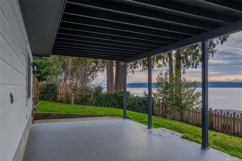 WALK-ON WATERFRONT! This stunningly renovated two-story beachfront home in scenic Powell River is perched at the shores of the Salish Sea with breathtaking ocean views and panoramic sunsets. The split-level two story home features a bright and open m...