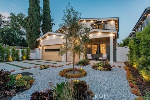 Nestled in the prestigious community of Tarzana, this securely gated home offers five bedrooms and five-and-a-half bathrooms. The interior boasts exquisite paneling walls, including custom white oak millwork and panels. The first floor features a dec...