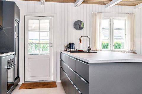 This completely renovated cottage is located in a popular area with a short distance to playgrounds and football field at As Vig. The house has a great view of the water from both house and terrace. The open kitchen is directly connected to the brigh...