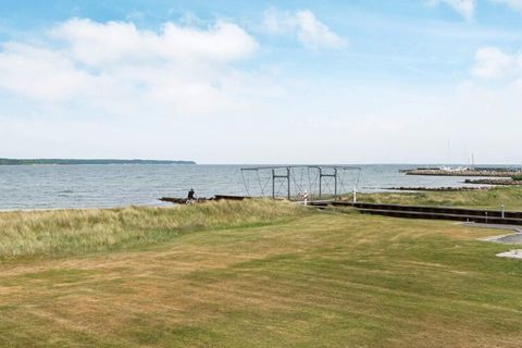 This holiday cottage, built in 2005, is situated on a salt meadow approx. 60 m from the sea. The cottage has an amazing, panoramic view over Sandbjerg Vig and Kattegat as well as a partial view to the fishing harbour and marina - a view that you must...