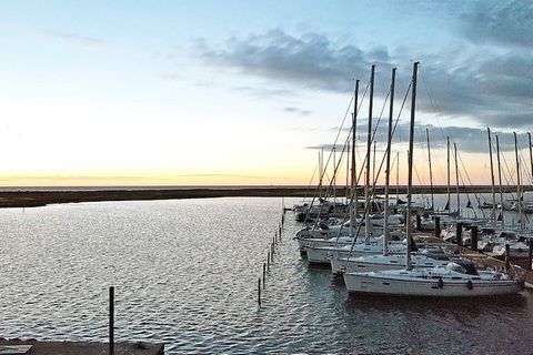 Modern and comfortable ground floor apartment with views to the Baltic Sea and the marina. The apartment consists of a kitchen / living room with access to the terrace, two double bedrooms and one with two single beds and a bathroom with underfloor h...