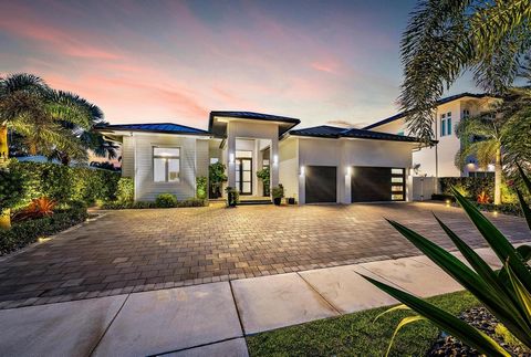 Completed in the latter part of 2021, this magnificent single-story tropical waterfront sanctuary combines chic contemporary design, soaring ceilings, and an impressive open floor plan. No detail has been left to chance, as the residence showcases im...