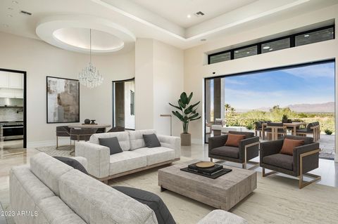 PRICE REDUCED $1.5M! This exquisite single-level property offers a blend of luxury and sophistication. Featuring 6 bedrms + 8 bathrms spread across its expansive 9,372 sqft, it showcases breathtaking views of Mummy Mountain, McDowell Mountain, + city...