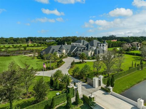 Bask in the grandeur of this nearly 8-acre Southwest Ranches estate, an architectural marvel transcending luxury living. This newly designed manor is the essence of resort-style living blending state-of-the-art features w/timeless elegance. Upon ente...