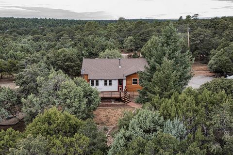 Great Mountain Retreat on 3 acres completely fenced, nestled in the trees, 3 bedroom, 1 bath, 106 sq ft remodeled sunroom, not included in the square footage, mostly wood floors, carpet in bedrooms, underneath bedroom carpet are wood floors, enjoy th...