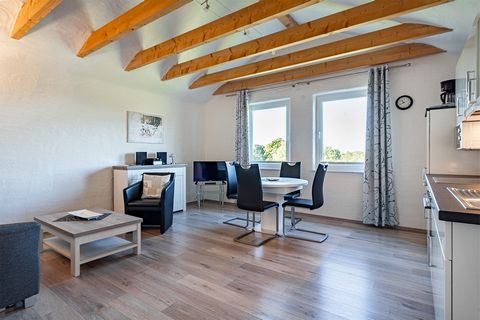 The charming apartment with its inviting loggia offers a spectacular view of the idyllic moorland landscape of East Frisia and creates an oasis of peace and relaxation for every visitor. The cozy bedroom is equipped with a luxurious box spring bed th...