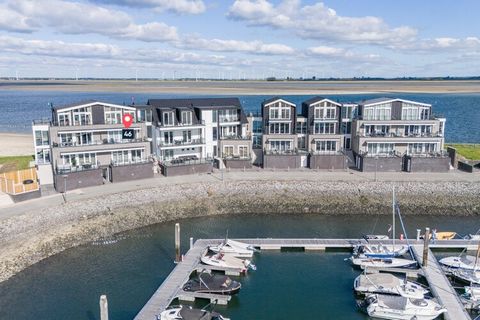 Réveillez-vous avec une vue imprenable sur le port et l'Escaut oriental dans ce superbe appartement à Sint-Annaland. Bénéficiant d'une vue panoramique, cet hébergement spacieux et luxueux offre la combinaison parfaite de confort, de tranquillité et d...
