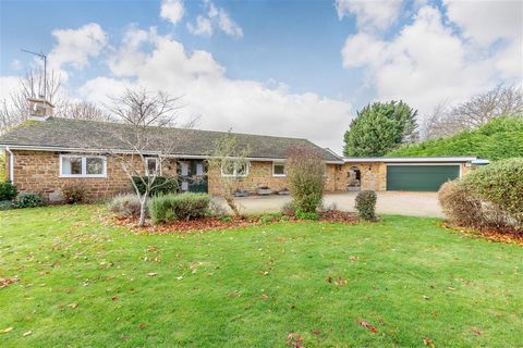 A very spacious and beautifully presented detached bungalow with stunning views, comprising entrance hall, cloakroom/shower room, breakfast kitchen, utility room, three reception rooms, indoor swimming pool complex, four bedrooms, four bathrooms, dou...