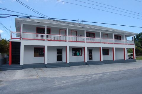 This centrally located two story commercial building contains three, one bedroom apartments upstairs with 641 sq. ft. each and two large shop spaces on the ground floor 1,260 sq. ft. each. The building is an excellent investment opportunity and incom...