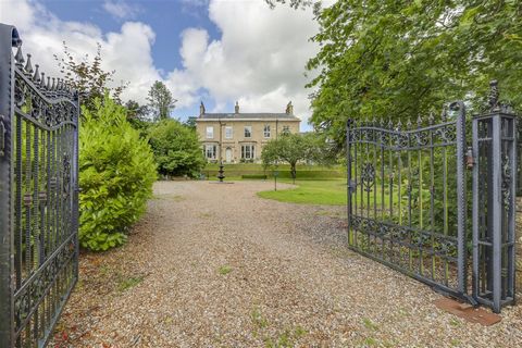 This exceptional family home has superb grounds, generous reception areas and a comparatively tucked-away location, surrounded by superb mature planting and accessed through its electric gated entrance. Recently enlarged, the property now has accommo...