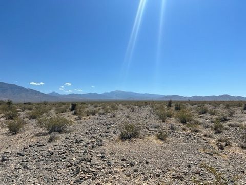 Escape the heat of Las Vegas with this huge rural parcel! Lots of potential for any dream home. Views of mountain ranges and just outside the growing city of Pahrump!