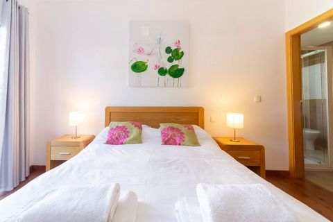 This is a luxury holiday home in Fuseta in the Algarve region of Portugal with a private garden and a shared infinity pool. It is ideal for a family with children. This resort is the ideal place to enjoy a luxury holiday close to the sea. You can swi...