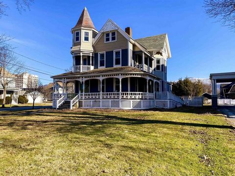 Check out this stunning Victorian building with many original features and just enough updating to experience the joy of easy living. From the moment you walk in, you'll feel at home! Natural light streams in the multitude of windows throughout the h...