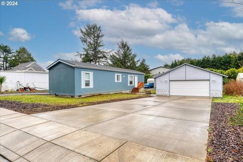 Live your best life at the beach in this pristine 2021 manufactured home. You'll have room for all your toys and space for your hobbies with its oversized 810 sq ft detached garage and extra long concrete driveway. Room for your boat(s), RV, ATVs, et...