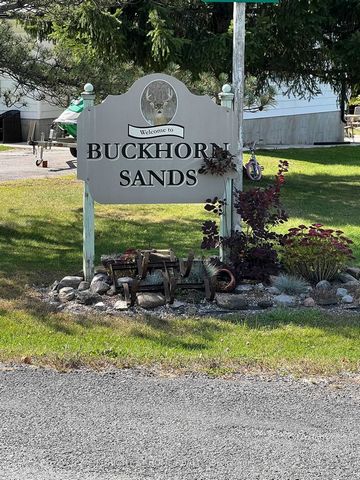 Beautiful and rarely found building lot available in the prestigious Buckhorn Sands Estates on Upper Buckhorn Lake. The property is just under an acre in size with water access through four association owned parks available just a short walk away!. T...