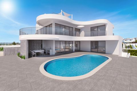 This four bedroom villa for sale in Porto de Mós is currently under construction, located in a private residential area, only a four minutes drive from the beach and walking distance from all sorts of amenities. The property comprises an entry hall l...