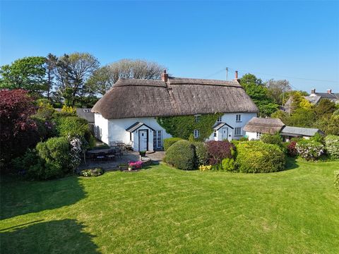 Tucked away in a tranquil setting with breathtaking countryside and coastal views, this charming Grade II listed detached Cornish cottage, believed to have built around the turn of the 18th century, is a true rural gem. With a distinctive thatched ro...