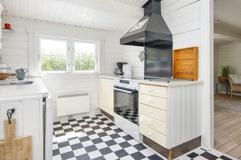 A small dog allowed. A real cottage on Fanø on a large and lovely enclosed natural plot with plenty of space for play and games. Charming and cozy log house with 3 bedrooms for 5 people. Cozy furnishings with a new bathroom, a fine kitchen and a char...