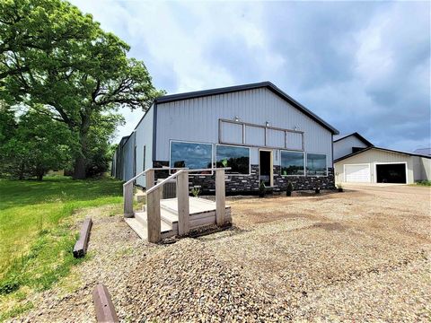 Opportunity knocks on Hwy 71 in a prime commercial location. The property offers over 82 feet of Hwy frontage. Property is finished on the interior with a completed bathroom. The North side of the building has a 14 foot garage door and service entran...
