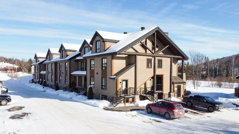 Domaine Nymark, this beautiful condo is located at the foot of Mont Saint-Sauveur, this site offers the prestige of a deluxe pied-à-terre within walking distance of various services and activities, all in a resort environment where life is good, A MU...