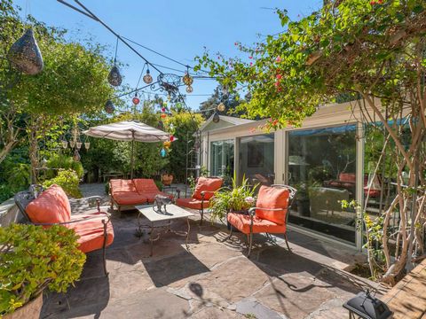 Escape to your very own two-bedroom, two-bathroom private hillside hideaway. This tucked away and charming 1,650-square-foot bungalow is nestled on a sprawling 13,000-square-foot lot above Sunset Boulevard and includes two parcels sold as one, offeri...