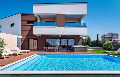 A luxurious 5-star villa for sale, superbly decorated, in Novalja on the island of Pag. It consists of a ground floor and a first floor, a total of 350 m2. On the ground floor there is a kitchen with a dining room, a living room with a fireplace, a b...