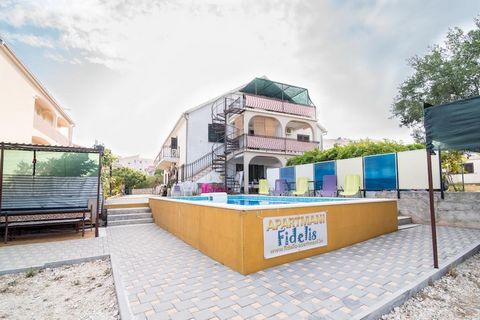 Apartments Fidelis feature set of accommodation units located in the island of Čiovo, Split region. Private parking available, reservation is not required. Baby cot available upon request. Pets allowed upon request, fees apply (12 EUR per night) Shar...