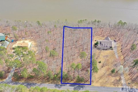 Picturesque Lakefront lot nestled in the ''Flat Swamp'' channel of High Rock Lake with some of the best fishing on a 360 mile shoreline. Stoney Point Harbor is a gated subdivision with a community boat ramp and docking pier; fenced boat/trailer stora...