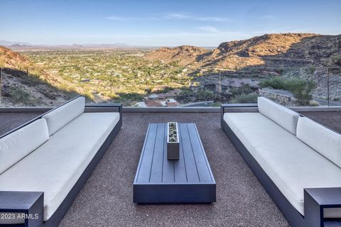 I defy you to find better views! In the GUARD GATED La Place du Sommet subdivision is a beautiful contemporary home high up on Mummy Mountain. Enter the glass pivot door of this 2017 stunning renovated home + you are awed by the magnificent unobstruc...