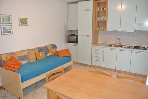 Situated in a central location within a small apartment building with parking just 200 meters from the beach, this first-floor apartment boasts new furnishings It comprises a living room with a single sofa bed and kitchenette, a bathroom with a boxed...