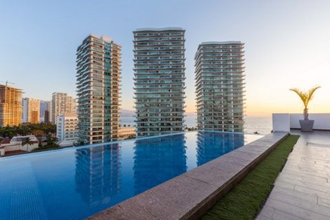 Condominium for Sale in Hotel Zone Puerto Vallarta Jalisco A spectacular turnkey property in this beautiful modern complex just steps from the beach restaurants and supermarkets. This bright open second floor corner unit features a high end kitchen g...