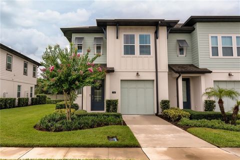 Expect to be impressed with this former model home in The Enclaves at Festival, located in the desirable Champions Gate area. It starts with great curb appeal – end unit with attractive landscaping (including beautiful crepe myrtle tree). Layout feat...