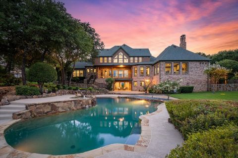 Stunning fully renovated WATERFRONT ESTATE in the prestigious guard gated community of Point Noble! Private and tranquil lake living in the city! Situated on over one acre with Lake Grapevine views from almost every room! This expansive home features...