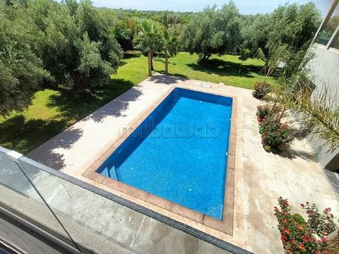 Contemporary villa located on the road to Fez, on a plot of 2380m² with 380m² of living space. It offers a large living room, a dining room with fireplace overlooking the swimming pool, a large kitchen, 4 suites with their bathrooms, two of which are...