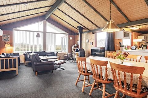 This holiday home is located overlooking the Limfjord by Livbjerggård on a 1300 m2 natural plot with a large lawn and trees that are suitable for children's play, and there is both a swing and a sandpit as well as a playhouse. There is also a cot and...