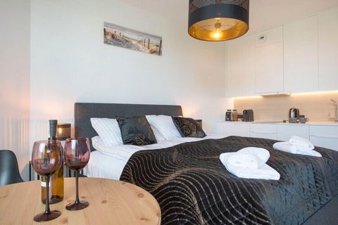 Comfortable apartment with SPA zone and swimming pools right next to the dunes in Pobierowo. The balcony offers a view of the pine forest and the sea. Guests have access to a fully equipped kitchen, a living room that also serves as a bedroom, a spac...