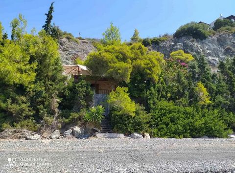 Seafront house for sale (8 meters from the sea) in Evia, Nerotrivia. The house has an area of 60 sq.m., located on a plot of 4000 sq.m., consists of a living room, a kitchen, one bedroom and a bathroom. Year of construction – 2007. There is a water w...