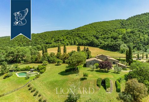 This stunning hamlet offers a unique panoramic view of the Val d'Orcia, in the province of Siena, famous for its sweet rolling hills, rows of olive groves and vineyards. This splendid property currently home to a holiday farm, consists of two fa...