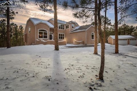A beautiful custom home surrounded by mature pines on 2.5 