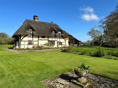 Dormers is a wonderful Grade II listed family home set within delightful grounds of about six acres in a rural village location. The earliest part of the property dates back to the early fifteenth century with later additions around 1900. The garden ...