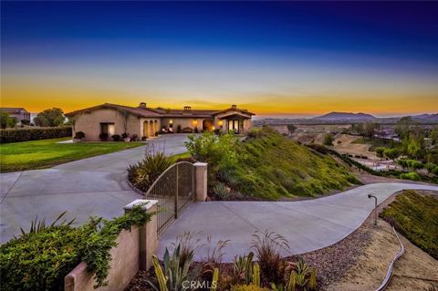 Enjoy incredible views of Temecula Wine Country, mountains, city lights, sunsets, and hot air balloons on 2.54 acres with a vineyard. This stunning home is located in the prestigious GlenOak Hills community. It features a dramatic architectural desig...