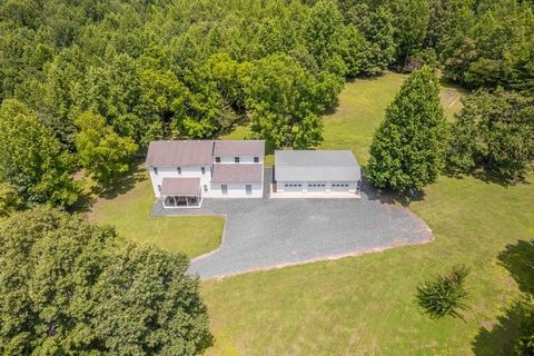 Your Gateway to Dream Living! Discover the home of your dreams on this sprawling 58.3-acre estate, offering endless possibilities for creating your own idyllic farmette or building additional homes on the 8 parcels nestled within the expansive acreag...