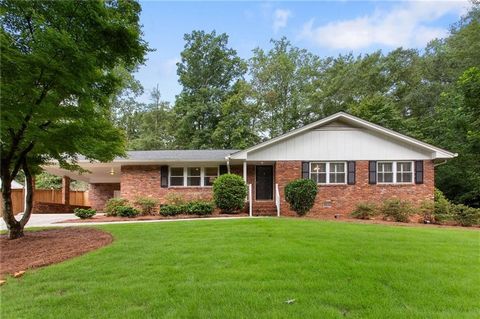 Don’t miss this gorgeous brick ranch home in Smyrna’s sought-after Forest Hills community! The lush lawn and manicured flower beds provide great curb appeal. Walk inside and find fresh paint, refinished hardwood floors, crown molding, plantation shut...